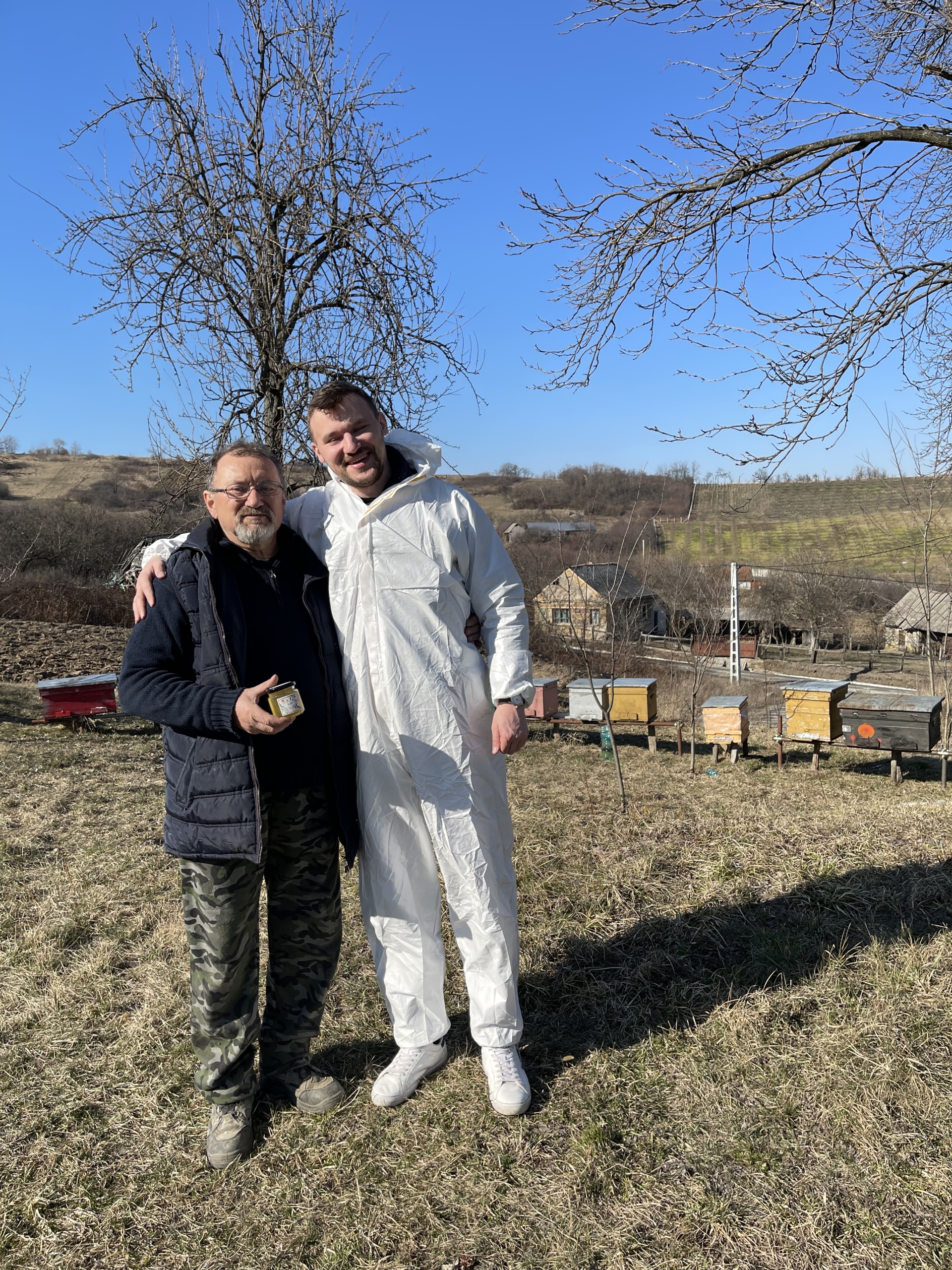 Nistor Fanel and Nistor Dragos working with their hives in the Transylvanian apiaries, two generations of a six-generation beekeeping family
