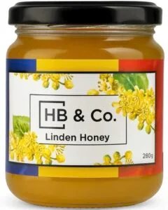 Jar of HoneyBee & Co. Linden Honey 280g with a light golden colour and floral Union Jack label design.