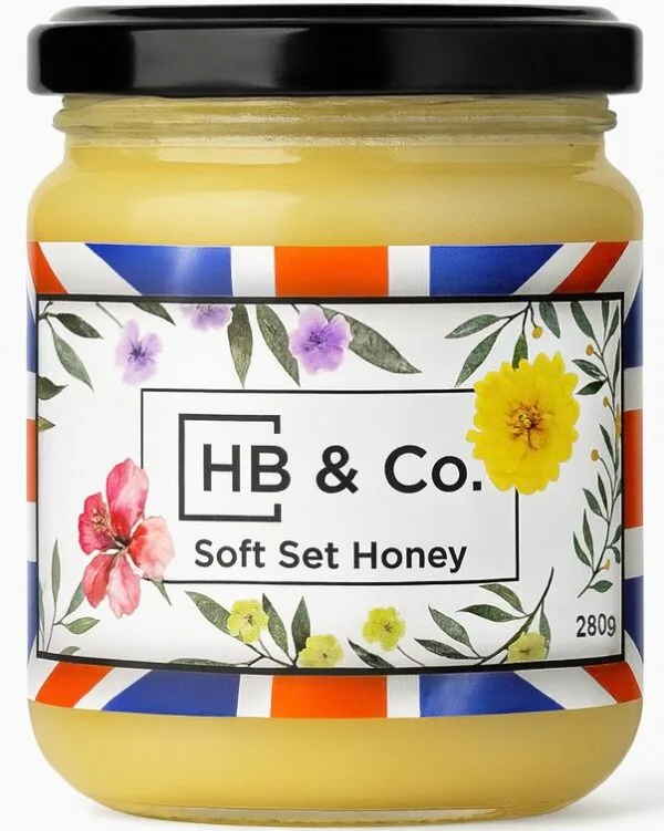 Jar of HoneyBee & Co. Soft Set Honey 280g with a creamy golden texture and floral Union Jack label design.