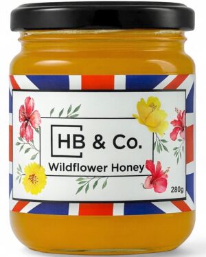 Jar of HoneyBee & Co. Wildflower Honey 280g with a golden amber colour and floral Union Jack label design.